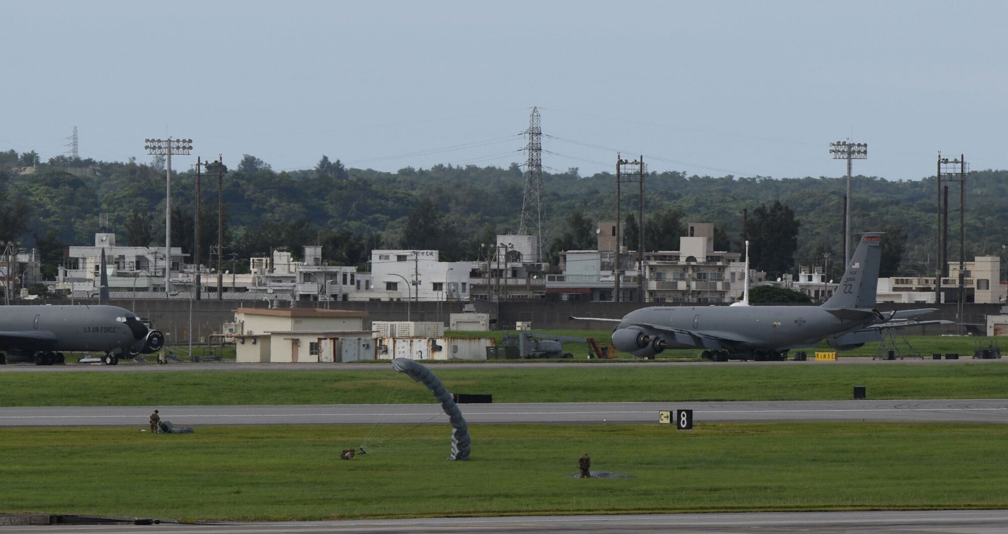 Air Force servicemembers conduct paradrop training at the Ridout drop zone July 9, 2020, on Kadena Air Base, Japan. All training on Kadena AB is conducted in accordance with bilateral agreements between the United States and the Government of Japan. Ie Jima is the primary location for overland U.S. military paradrop training in Okinawa. The bilateral agreements allow for the use of Kadena AB as an alternate location when Ie Jima is not available to meet the immediate training needs of U.S. forces.