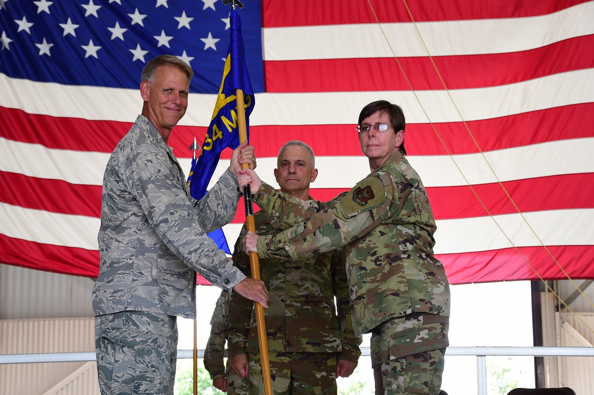Col. Gretchen Wiltse, 434th Mission Support Group commander, receives the guidon from Col. Larry Shaw, 434th Air Refueling Wing commander, during a change of command ceremony at Grissom Air Reserve Base, Indiana July. 9, 2020. Wiltse joins MSG from Grissom’s maintenance group, where she also served as the group commander. 
(U.S. Air Force photo/SSgt. Chris Massey)