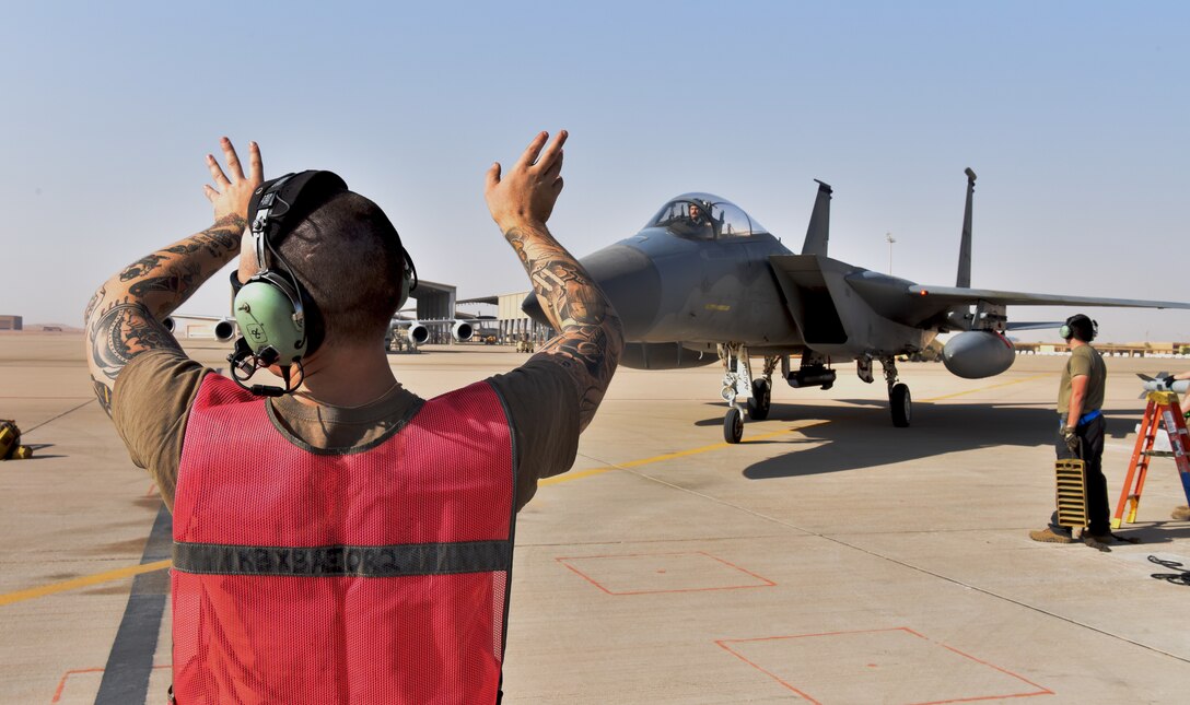 Airmen from the 378th Expeditionary Operations Group conduct an integrated combat turn to test their capability to land, refuel, weapons reload and take off.