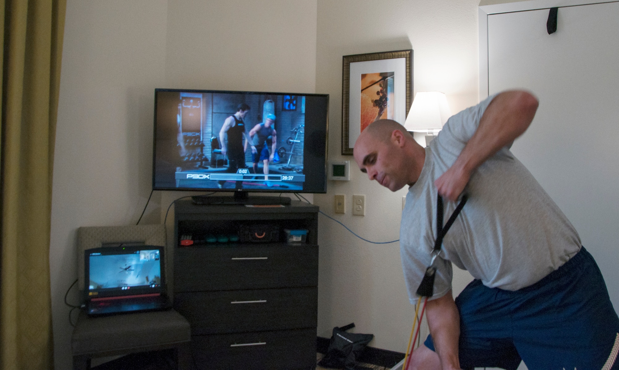 Airman exercises with father via Skype