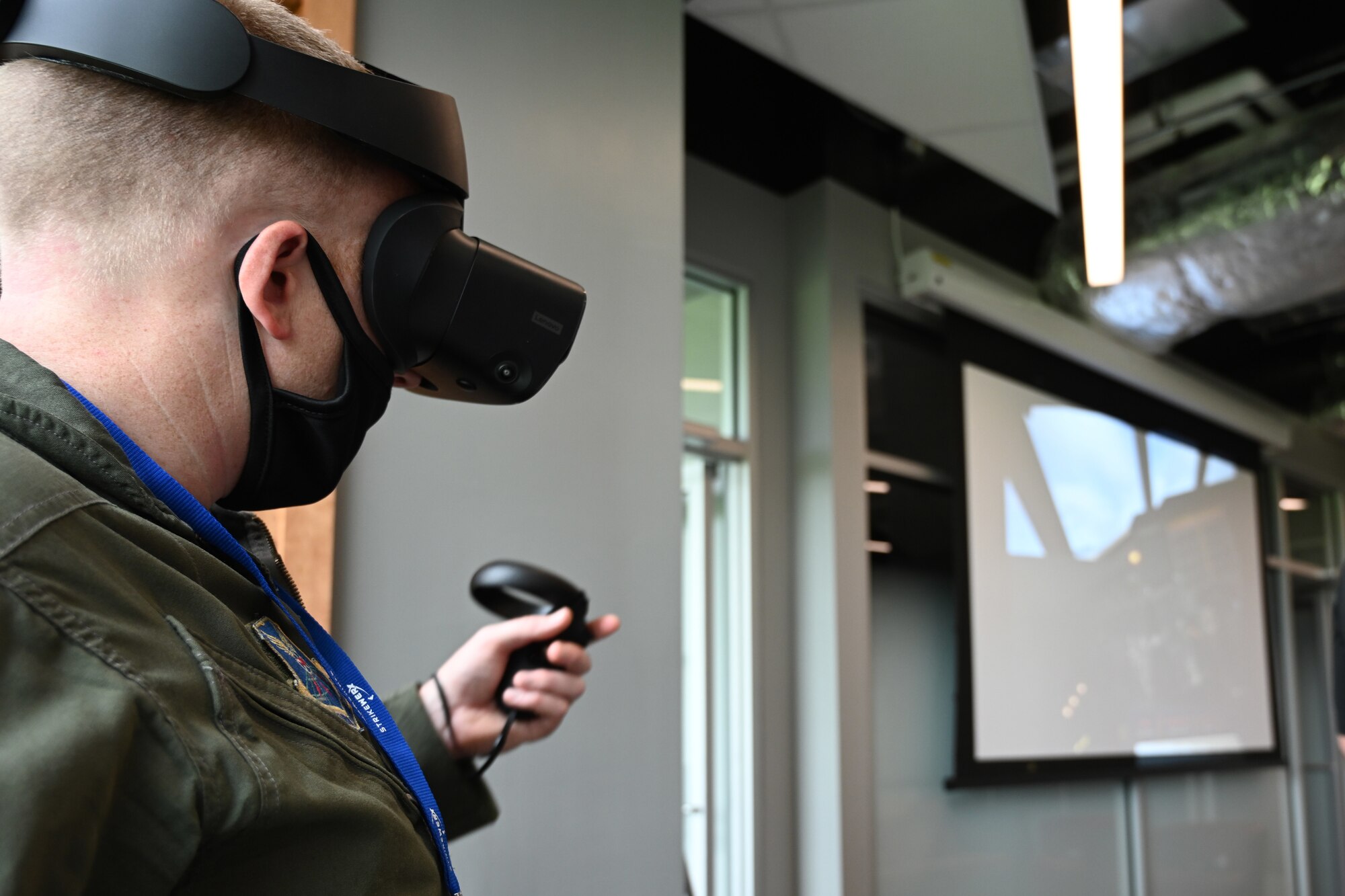 An Airman practices with a virtual reality trainer.