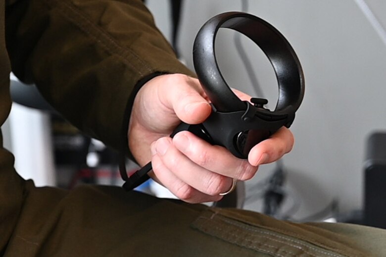 An Airman works a virtual reality trainer