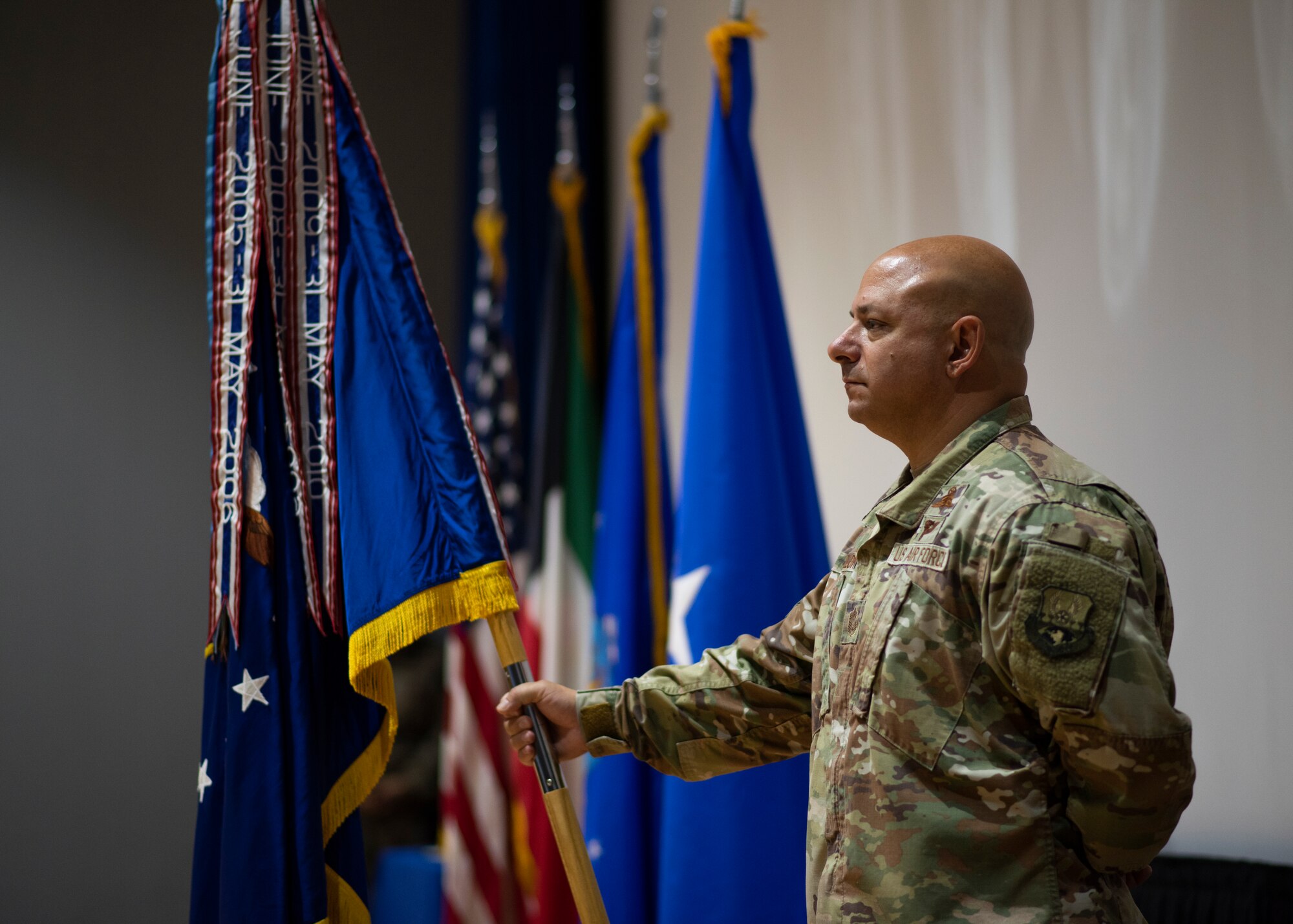 Airman holds ceremonial guidon