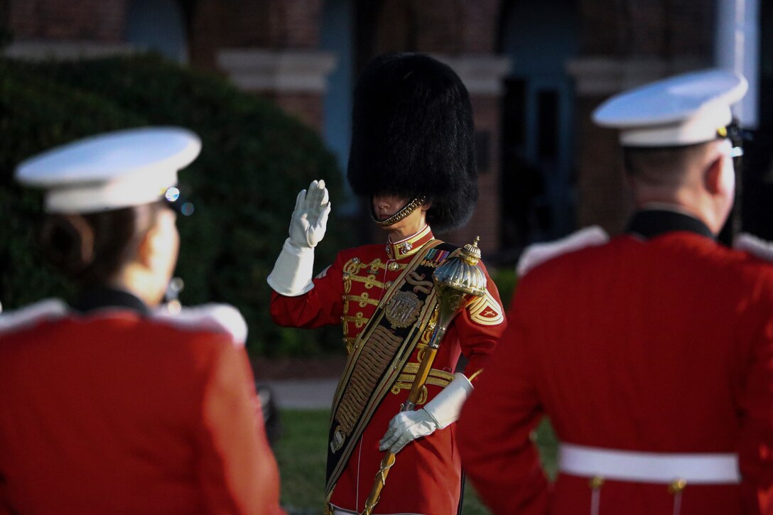 Gunnery Sgt. Monica Preston, assistant drum major, “The President’s Own” U.S. Marine Band, conducts the band during a Friday Evening Parade at Marine Barracks Washington, D.C., July 7, 2020. Admiral Michael M. Gilday, chief of naval operations, was the guest of honor, and the hosting official was the 38th Commandant of the Marine Corps, Gen. David H. Berger. (U.S. Marine Corps photo by Cpl. James Bourgeois)
