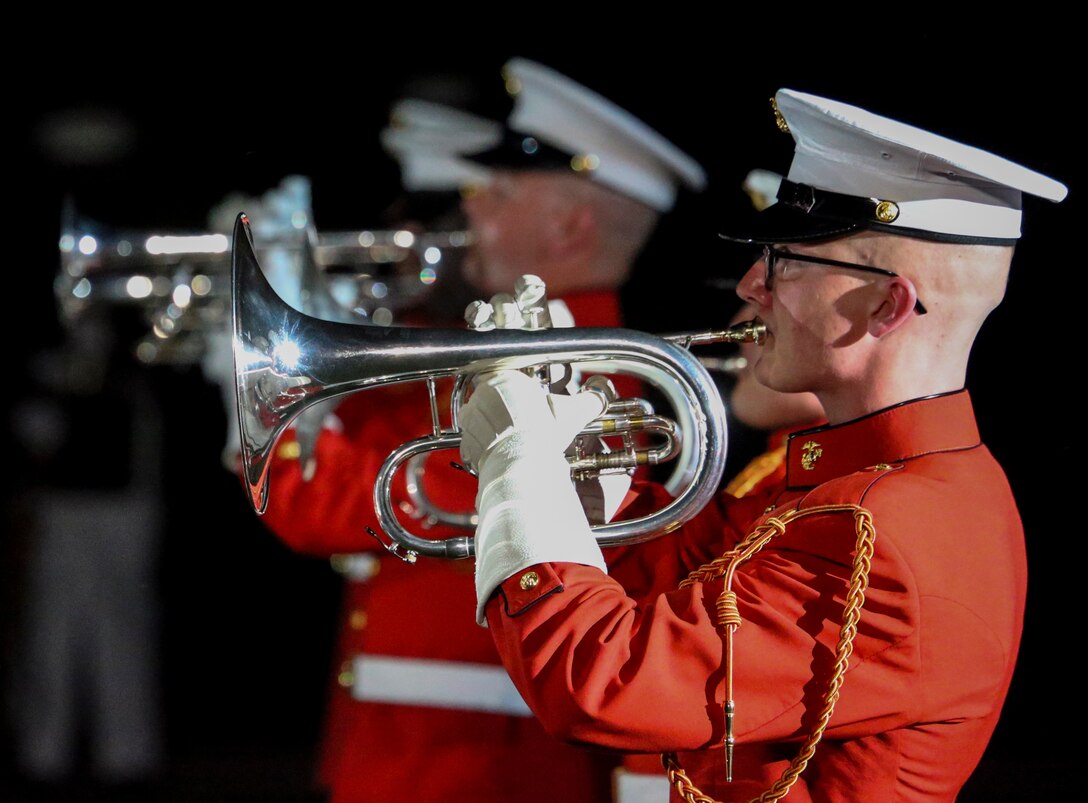 Corporal Eric Miller, uppers section, “The Commandant’s Own” U.S. Marine Drum and Corps, performs during a Friday Evening Parade at Marine Barracks Washington, D.C., July 7, 2020. Admiral Michael M. Gilday, chief of naval operations, was the guest of honor, and the hosting official was the 38th Commandant of the Marine Corps, Gen. David H. Berger. (U.S. Marine Corps photo by Cpl. James Bourgeois)