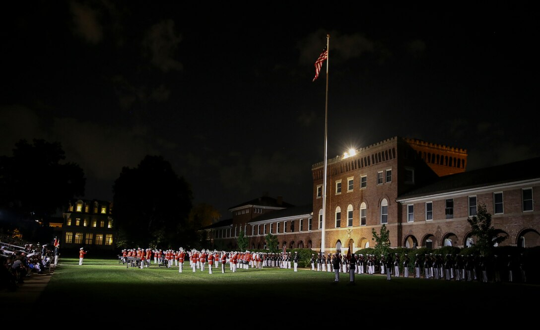 Marines with Marine Barracks Washington perform during a Friday Evening Parade at Marine Barracks Washington, D.C., July 7, 2020. Admiral Michael M. Gilday, chief of naval operations, was the guest of honor, and the hosting official was the 38th Commandant of the Marine Corps, Gen. David H. Berger. (U.S. Marine Corps photo by Cpl. James Bourgeois)