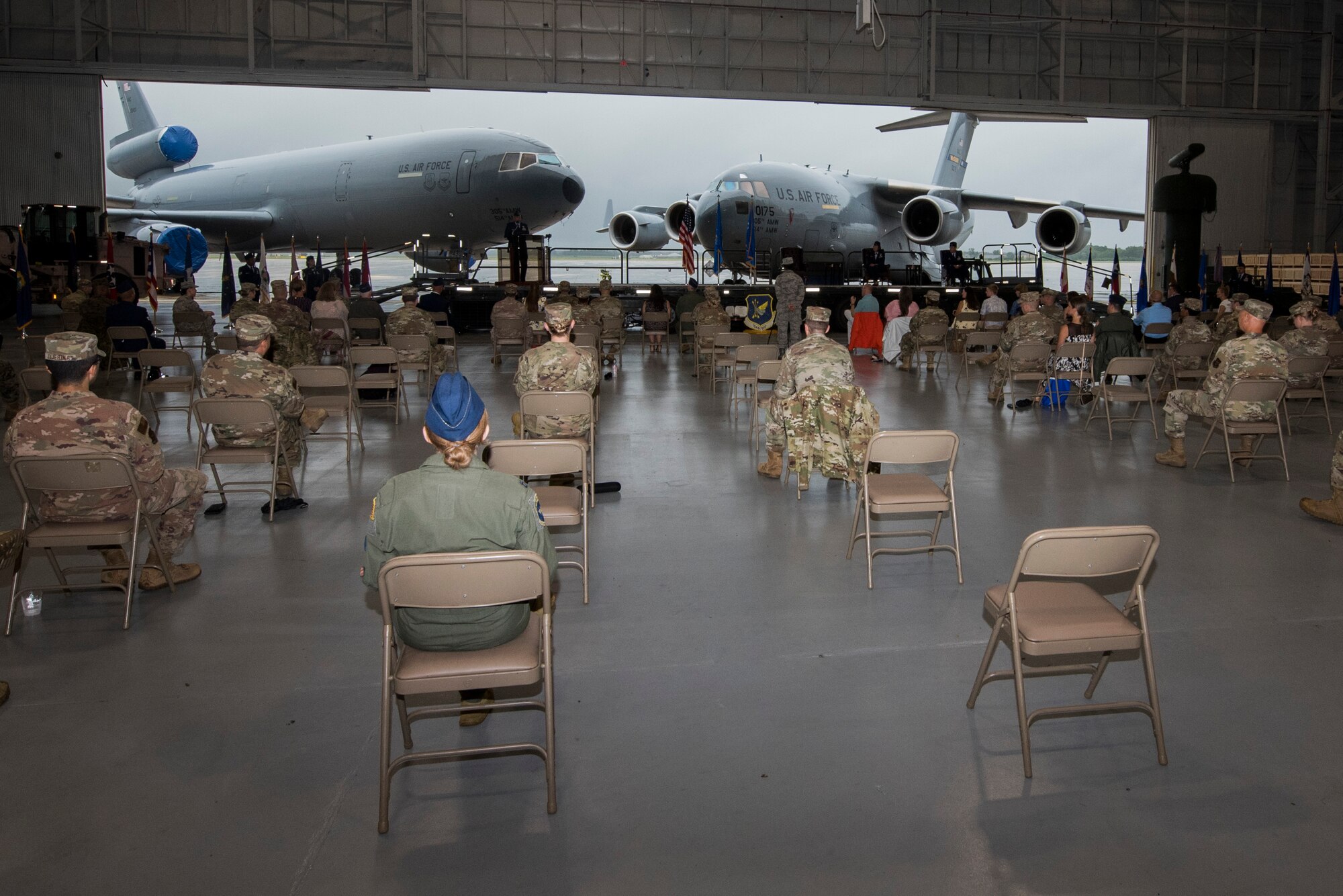 Photo Airmen giving attending a change of command ceremony.