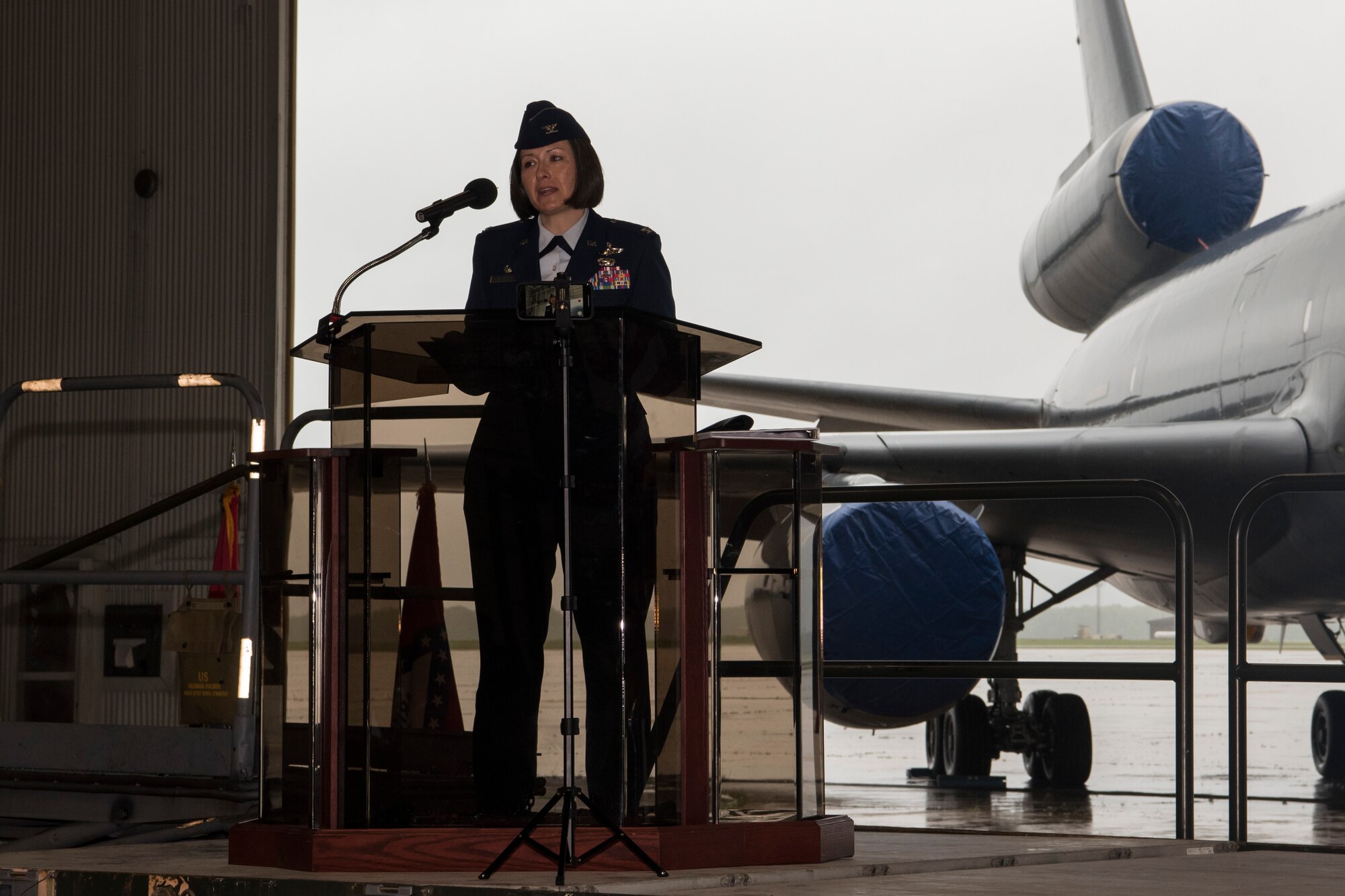 Photo of an Airman giving remarks during a change of command ceremony.