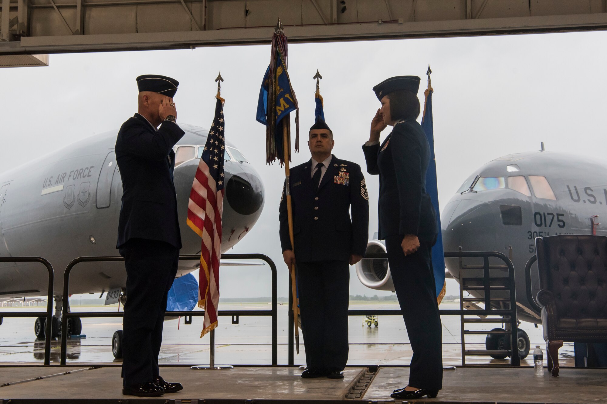 Photo of an Airman saluting another Airman  during a change of command ceremony.