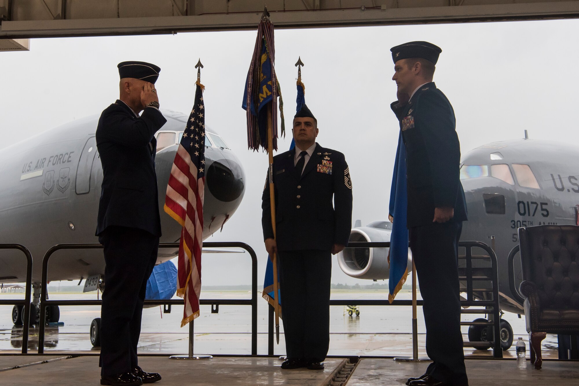 Photo of an Airman saluting another Airman during a change of command ceremony.