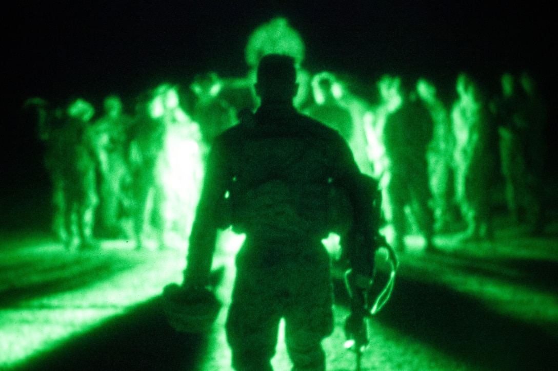 A U.S. Marine listens to a convoy debrief at Robertson Barracks, Australia, July 9.