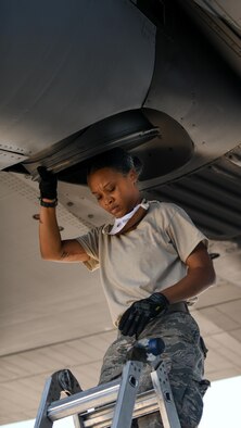 Senior Airman Dayna Jones, a crew chief with the 910th Maintenance Squadron, steps down from a ladder after performing a thru-flight inspection on a C-130H Hercules on Youngstown Air Reserve Station’s flightline, July 7, 2020. Crew chiefs use thru-flight inspections to search for any loose, broken or corroded parts and foreign material prior to takeoff.