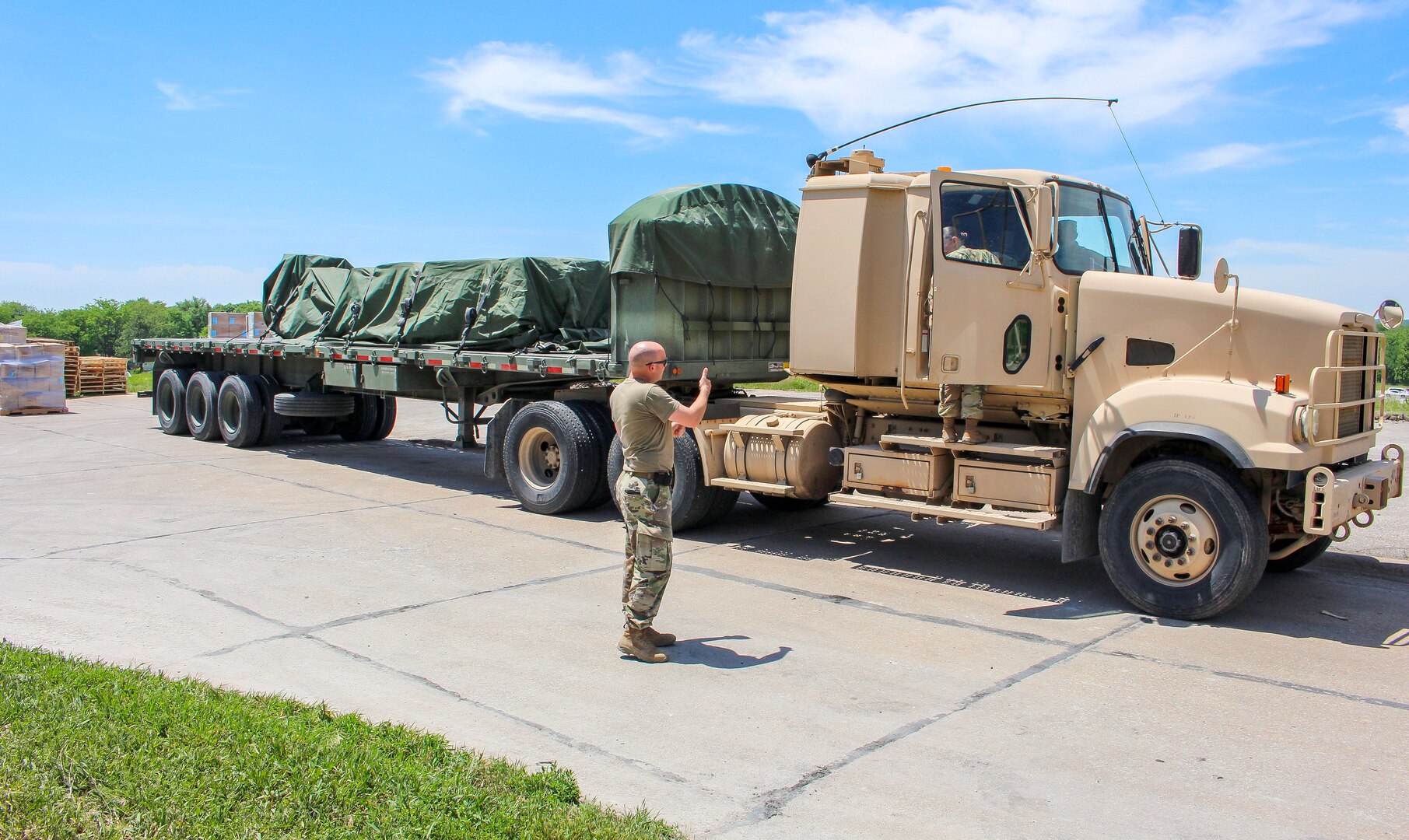 Nebraska Army National Guard Soldiers move personal protective equipment from a warehouse June 2, 2020, in Lincoln, Nebraska. The Nebraska National Guard delivered PPE across the state to all the local health departments.