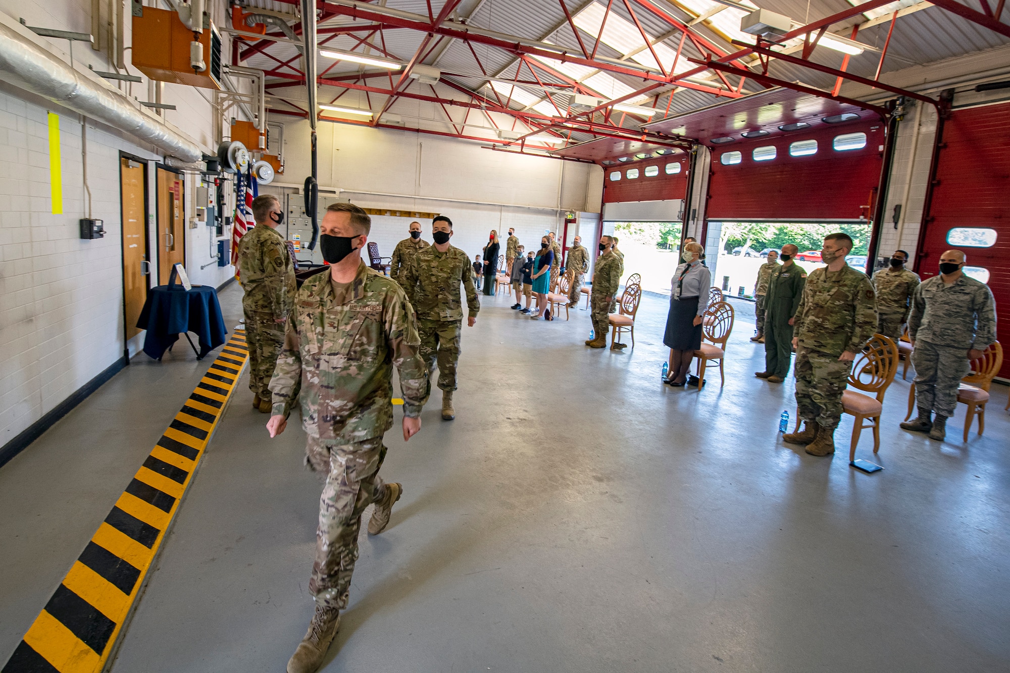 U.S. Air Force Col. Jon T. Hannah, left, 422d Air Base Group commander, Maj. Christopher Wood, center, 420th Munitions Squadron (MUNS) incoming commander, and Maj. Kenneth French, rear, 420th MUNS outgoing commander, exit as the official party during a change of command ceremony at RAF Welford, England, July 10, 2020. The change of command ceremony is a military tradition that represents a formal transfer of a unit’s authority and responsibility from one commander to another. (U.S. Air Force photo by Senior Airman Eugene Oliver)
