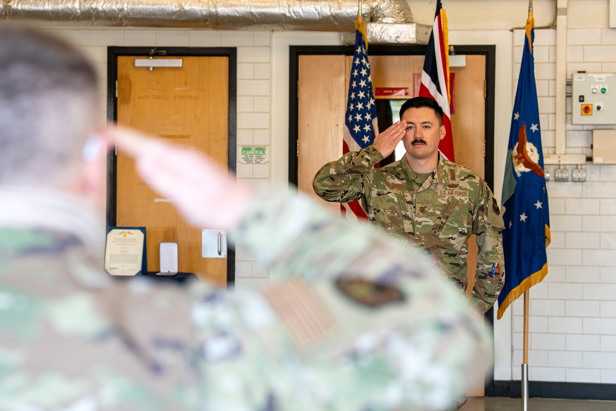 U.S. Air Force Maj. Christopher Wood, 420th Munitions Squadron incoming commander, renders a first salute during a change of command ceremony at RAF Welford, England, July 10, 2020. Wood previously served as the Nuclear Maintenance Branch Chief, US Air Forces in Europe - Air Forces Africa, Ramstein Air Base, Germany. (U.S. Air Force photo by Senior Airman Eugene Oliver)