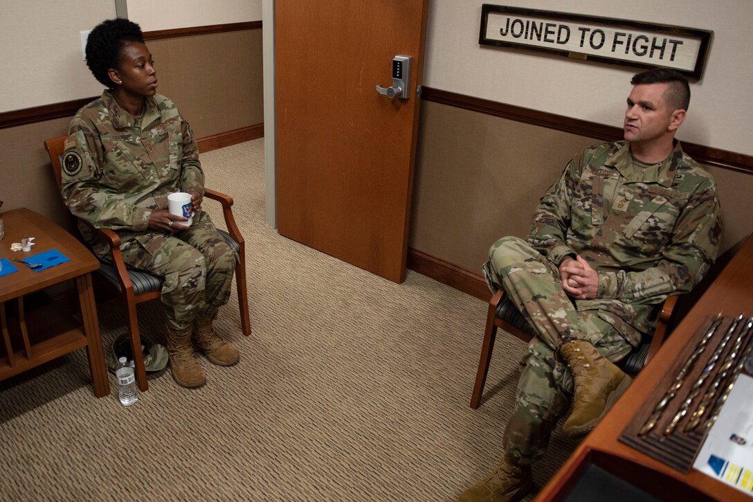 A photo of leadership talking to each other.