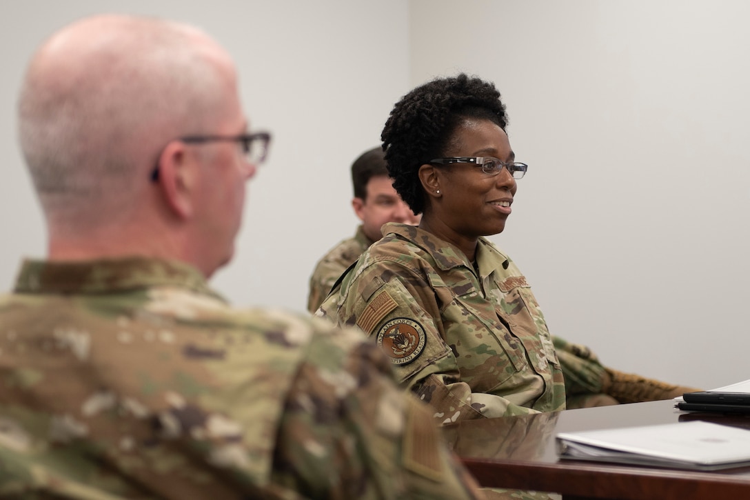 Photo of a Chief Master Sergeant smiling.
