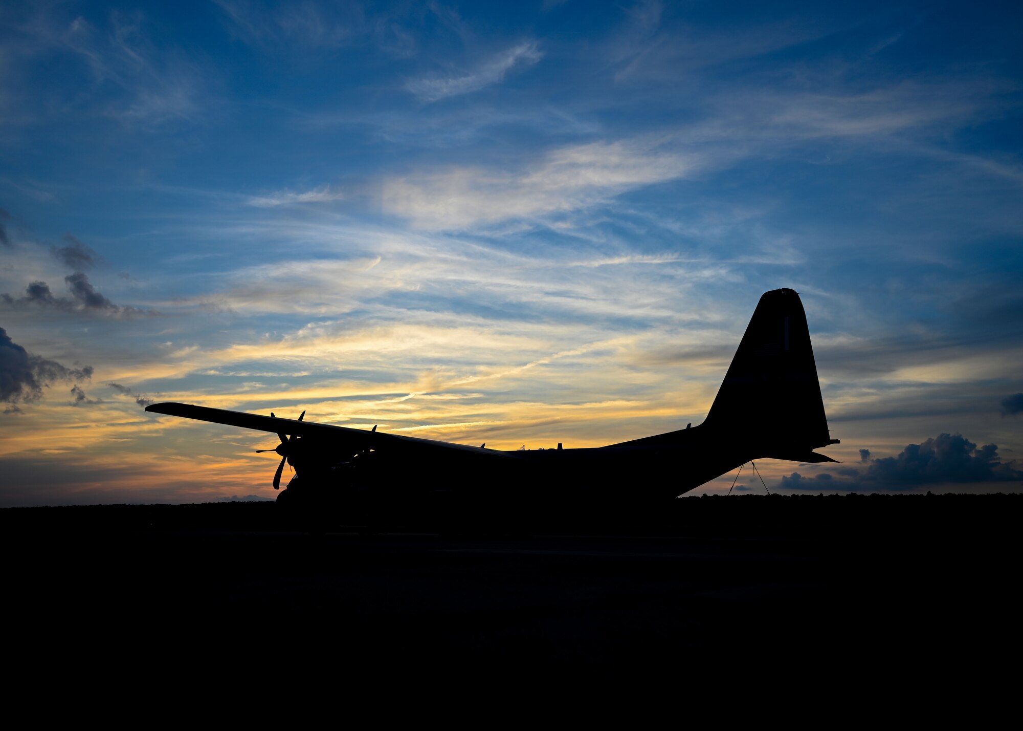 A C-130J Super Hercules sits on the flightline.