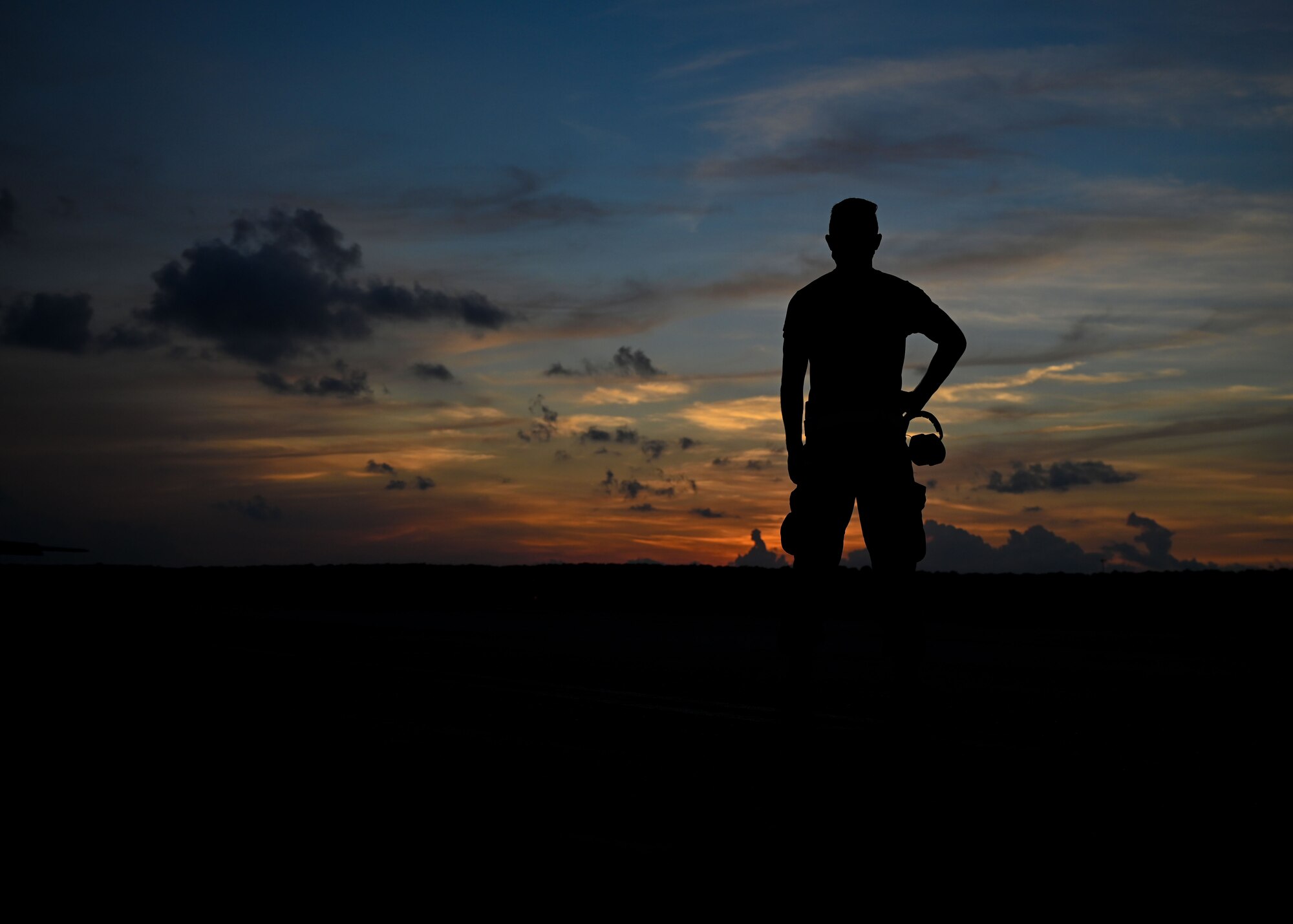 An Airman stands on the flightline.