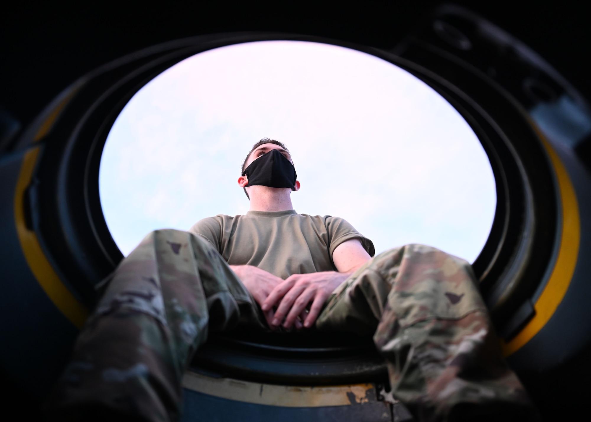 An Airman sits on a C-130J Super Hercules.