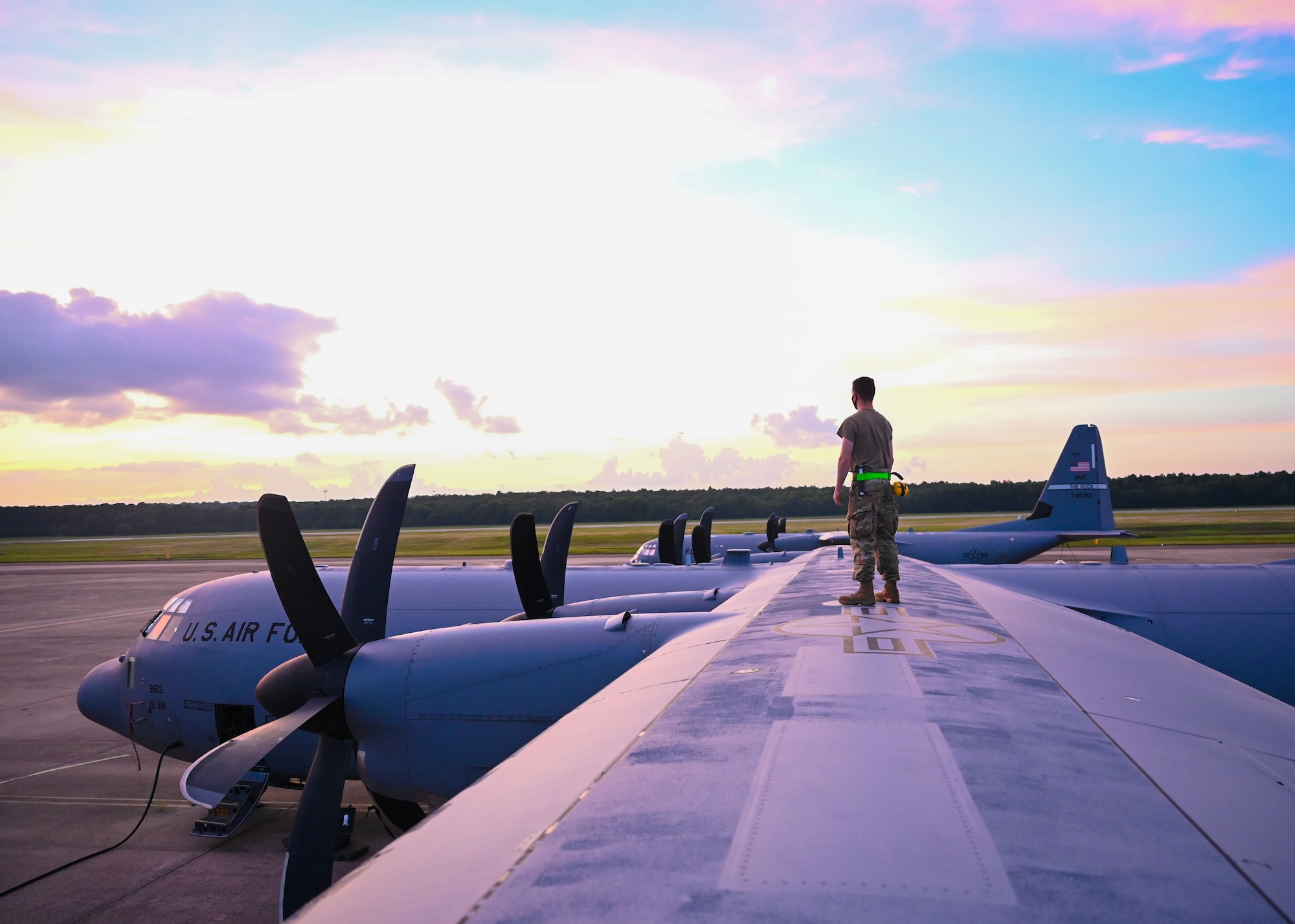 An Airman stands on a C-130J Super Hercules.