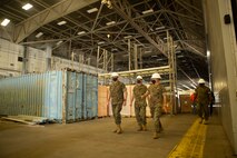 U.S. Marine Corps Col. Curtis Ebitz, commanding officer of Marine Corps Air Station New River, and Lt. Col. Roger Holliday, director of MCAS New River installations and environment, escort Maj. Gen. Edward D. Banta, commanding general of Marine Corps Installations Command, through hangar AS-215 on MCAS New River, July 13, 2020. Banta is visiting military installations in Eastern North Carolina to receive an update on military construction from installation leaders and view hurricane related repairs to facilities and family housing currently in progress. (U.S. Marine Corps photo by Sgt. Breanna Weisenberger)