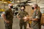 U.S. Marine Corps Col. Curtis Ebitz, commanding officer of Marine Corps Air Station New River, and Lt. Col. Roger Holliday, director of MCAS New River installations and environment, escort Maj. Gen. Edward D. Banta, commanding general of Marine Corps Installations Command, through hangar AS-4109 on MCAS New River, July 13, 2020. Banta is visiting military installations in Eastern North Carolina to receive an update on military construction from installation leaders and view hurricane related repairs to facilities and family housing currently in progress. (U.S. Marine Corps photo by Sgt. Breanna Weisenberger)
