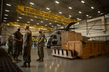 U.S. Marine Corps Col. Curtis Ebitz, commanding officer of Marine Corps Air Station New River, and Lt. Col. Roger Holliday, director of MCAS New River installations and environment, escort Maj. Gen. Edward D. Banta, commanding general of Marine Corps Installations Command, through hangar AS-4109 on MCAS New River, July 13, 2020. Banta is visiting military installations in Eastern North Carolina to receive an update on military construction from installation leaders and view hurricane related repairs to facilities and family housing currently in progress. (U.S. Marine Corps photo by Sgt. Breanna
Weisenberger)