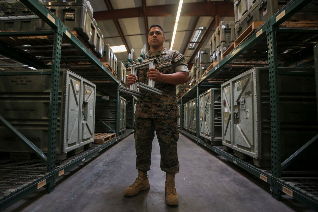Staff Sgt. Victor Cervantes, the Digital Manufacturing Platoon staff non-commissioned officer in charge with Ordnance Maintenance Company, 1st Maintenance Battalion, 1st Marine Logistics Group, developed an oxygen manifold to help ease the burden on medical staff on Camp Pendleton, California, June 25, 2020. For his role in the development and fabrication of an efficient oxygen manifold that can provide oxygen to multiple patients from one tank, Cervantes received the 1st MLG Innovation Award from 1st MLG Commanding General Brig. Gen. Bobbi Shea. (U.S. Marine Corps photo by Pfc. Ulises Salgado)