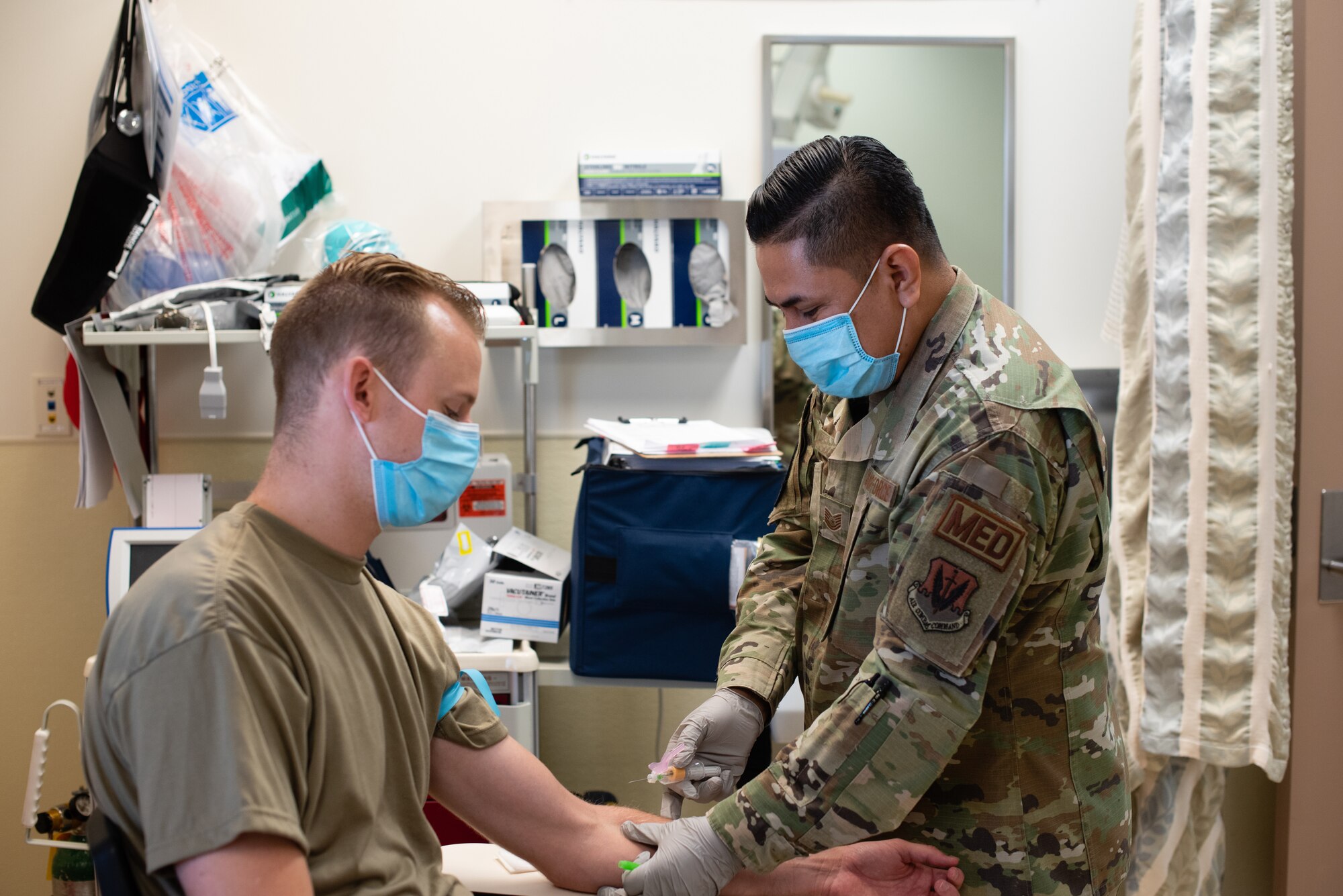 Airmen demonstrate a serology test at Creech Air Force Base.