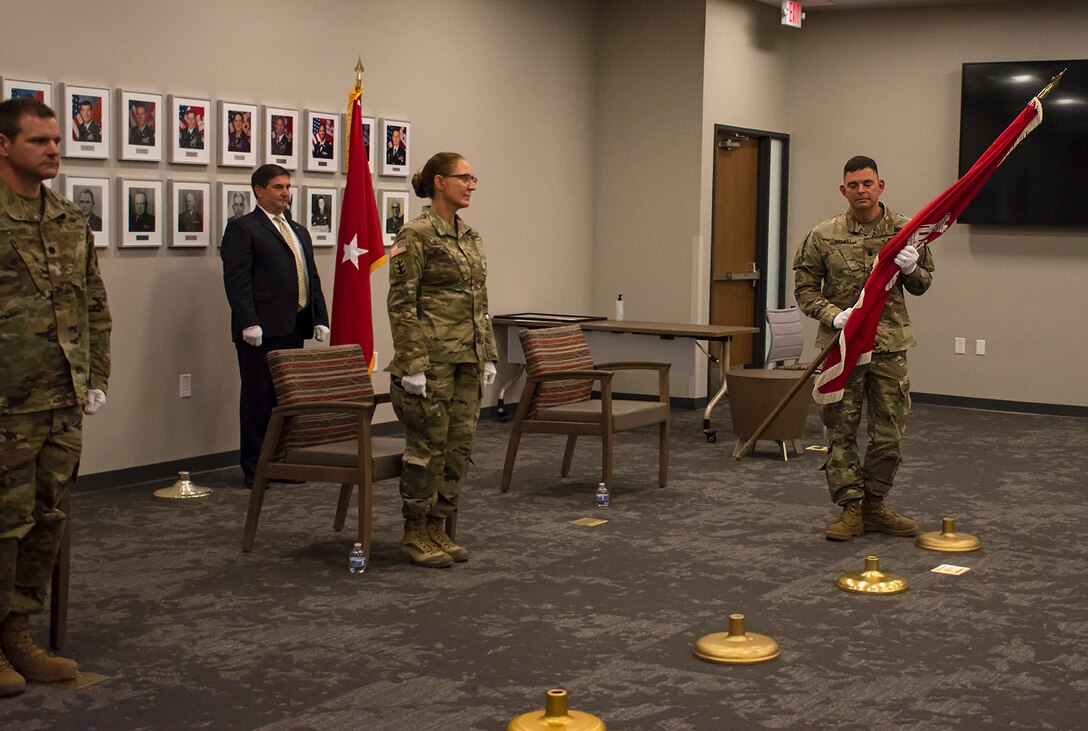 Lt. Col. Larry Caswell hands over command of the Albuquerque District, symbolized in the passing of the USACE flag, during the change of command ceremony at the district's office, July 9, 2020.