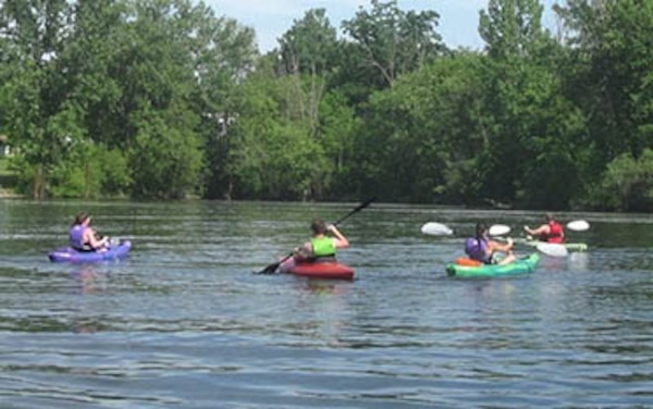 Paddle boaters enjoy a day on the lake.
