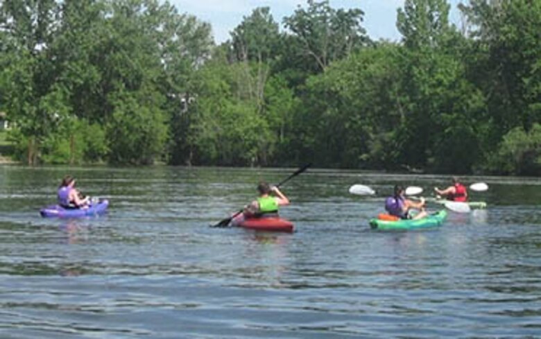 Paddle boaters enjoy a day on the lake.