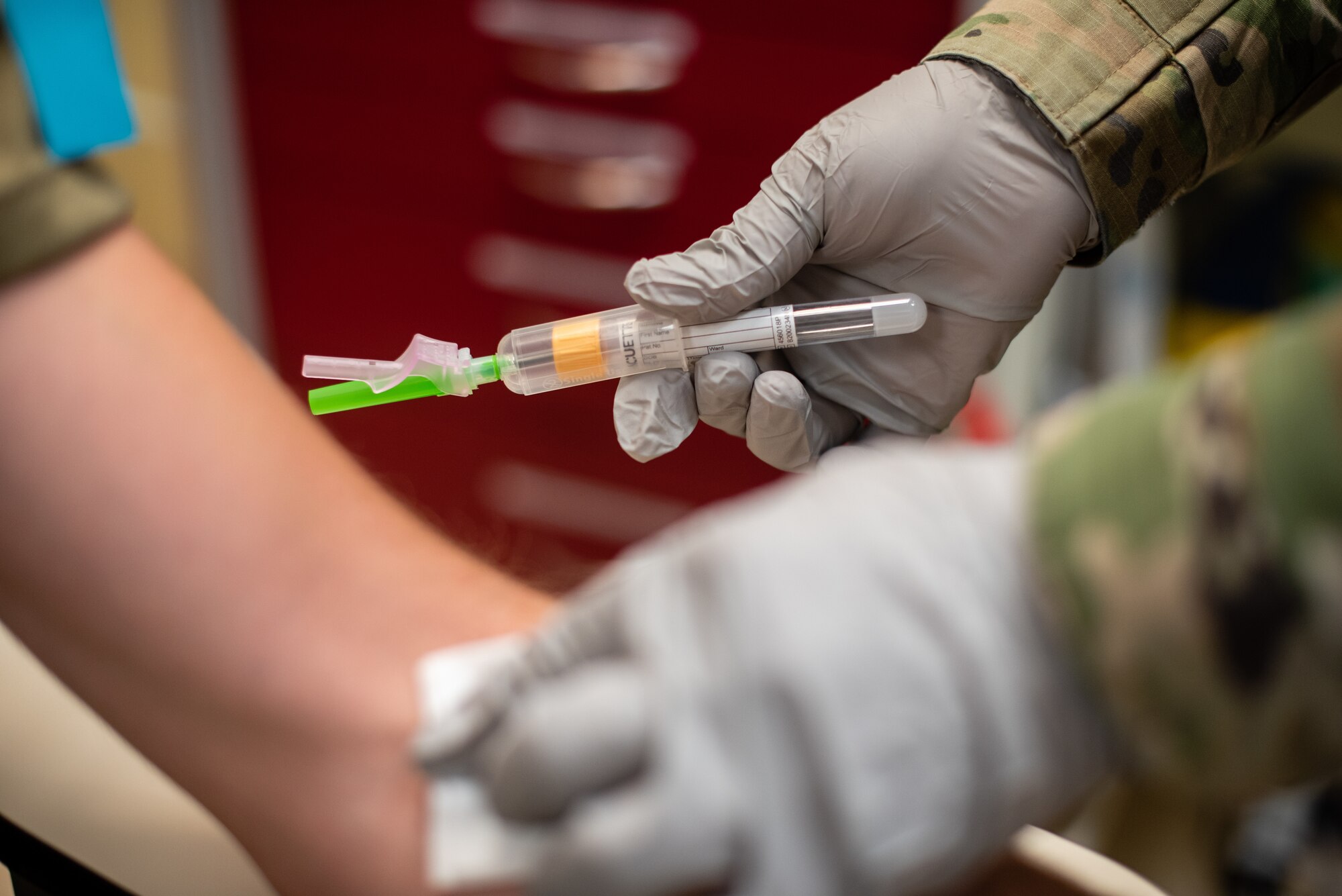 Airmen demonstrate a serology test at Creech Air Force Base.