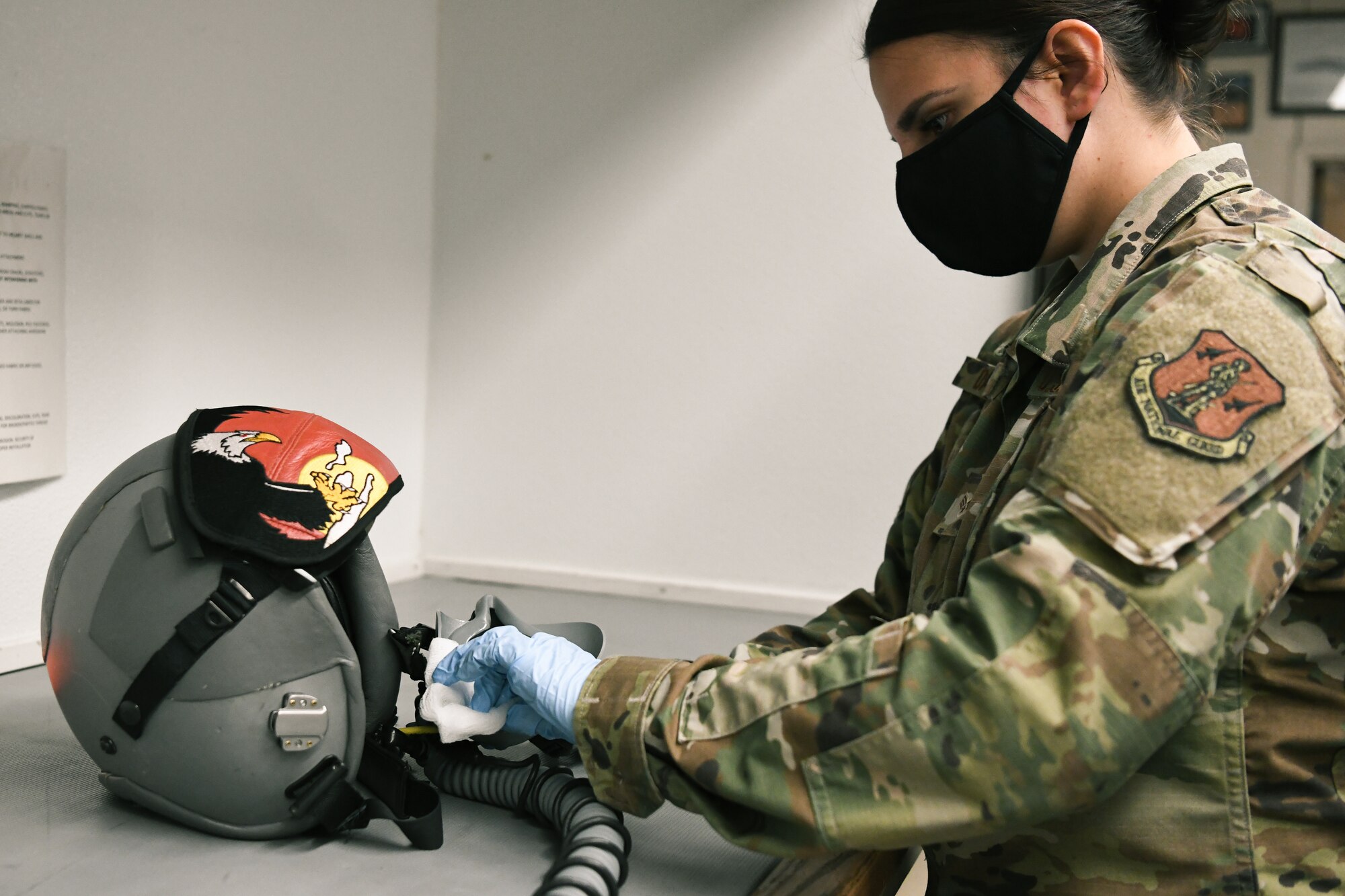 Airman cleans helmet