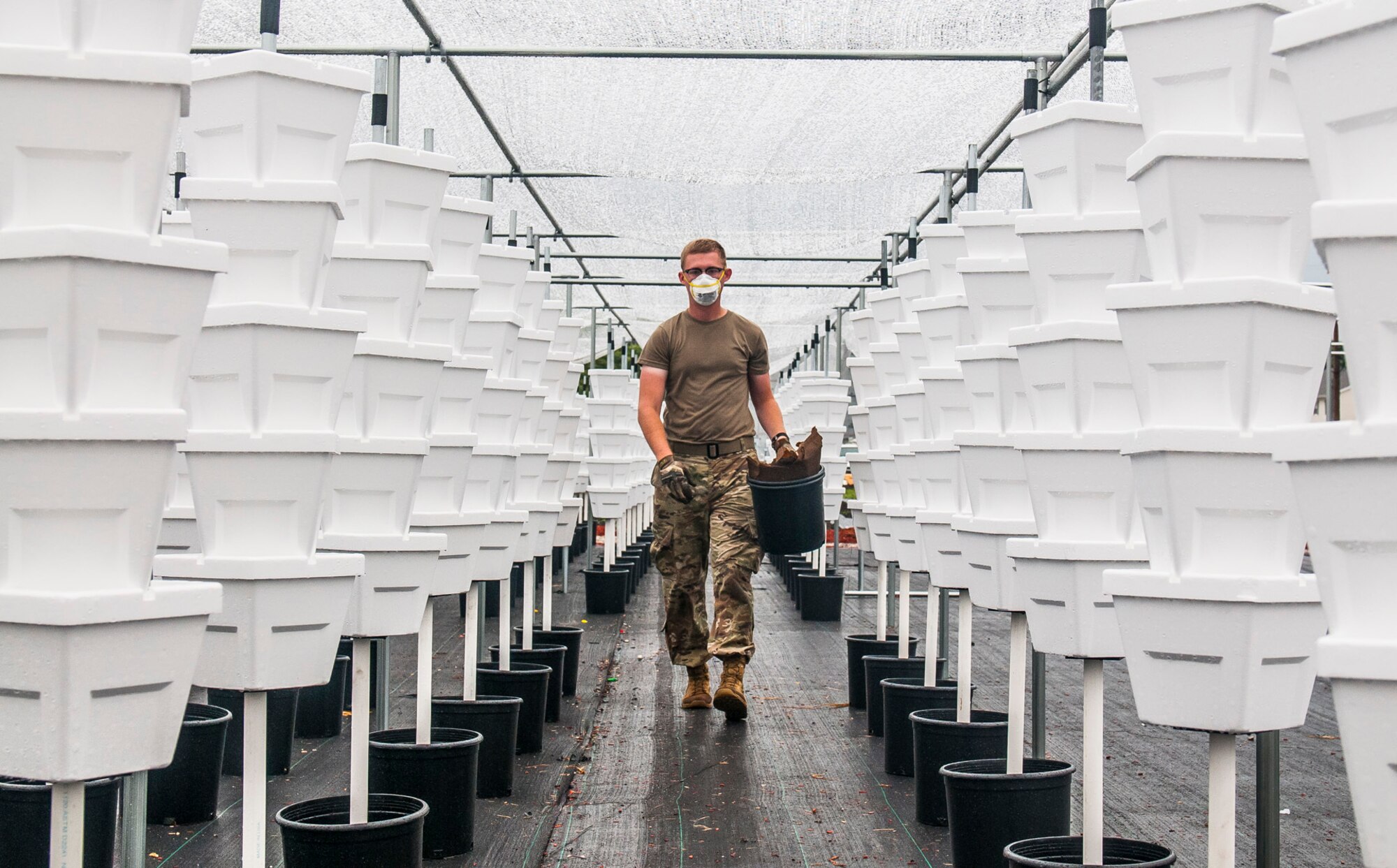 Spc. Nicholas Parker, a Soldier assigned to the Ohio National Guard’s 1st Battalion, 134th Field Artillery Regiment, cleans up around an urban farm June 23, 2020, in Columbus, Ohio. Parker and others in his unit have supported Mid-Ohio Foodbank’s operations during the COVID-19 pandemic since late March.