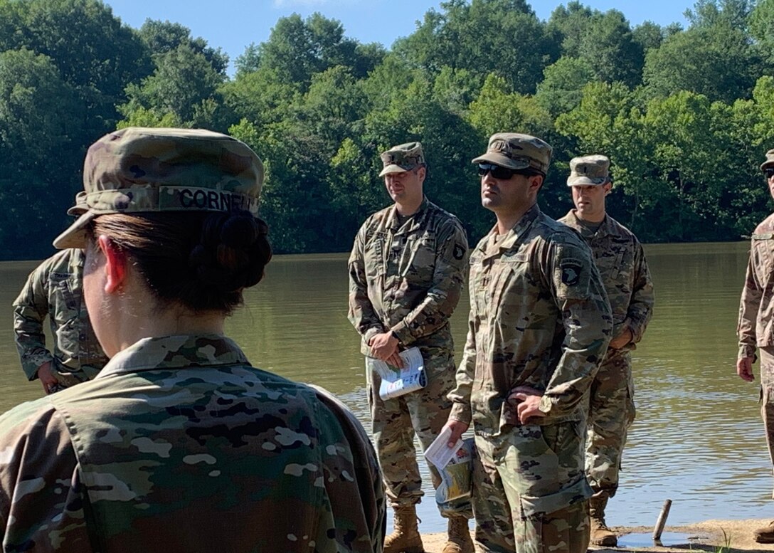 US Army Capt. Luke C. Dressman assigned to the U.S. Army Corps of Engineers Nashville District, sets up an easel next to the Cumberland River in preparation for a military leadership training course at Lock C in Indian Mound Tenn.  (USACE Photo by Daniel Barrios)