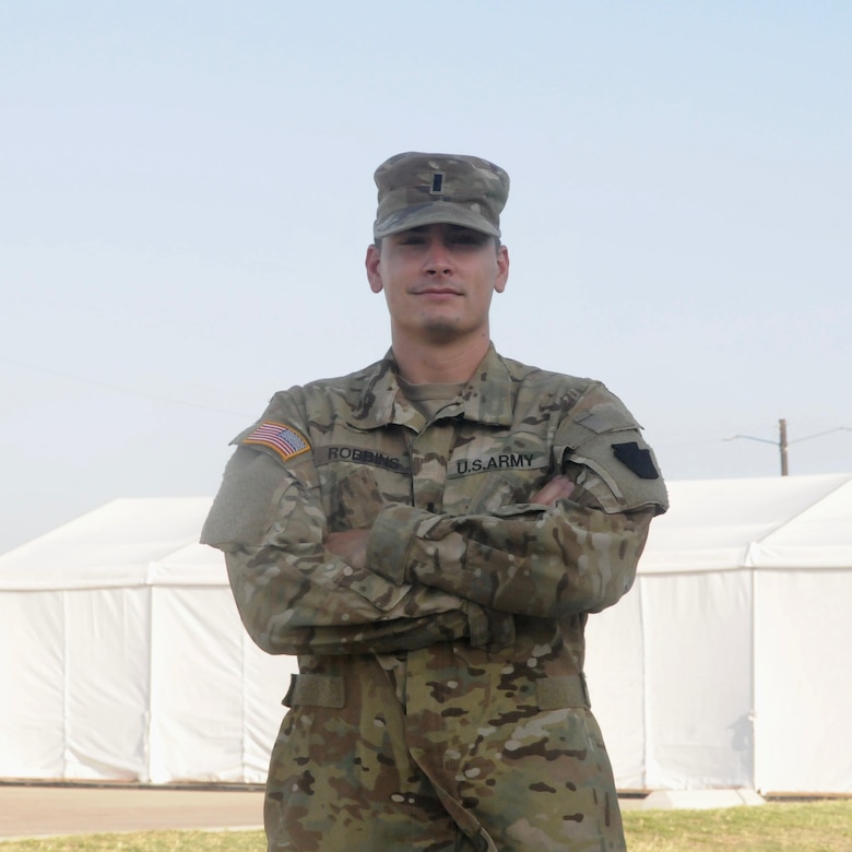 U.S. Army 1st Lt. Craig Robbins, UH-60 Black Hawk medevac pilot with Charlie Company, 2-104th General Support Aviation Battalion, 28th Expeditionary Combat Aviation Brigade poses for a photo at the 28th ECAB's mobilization station at Fort Hood, Texas. Robbins is the first-ever commissioned officer to receive the Pennsylvania Military Funeral Honors Ribbon.