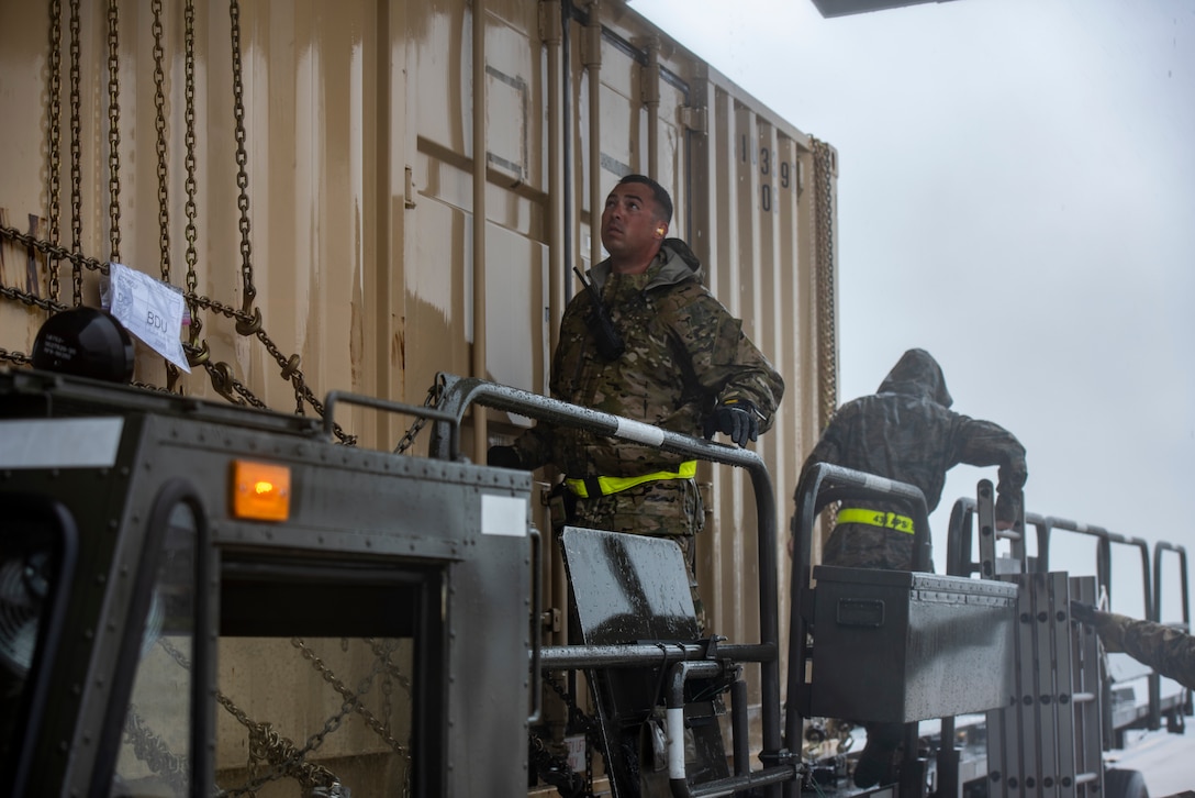Dover AFB continues its rapid global airlift mission, even during the extreme conditions of Tropical Storm Fay.