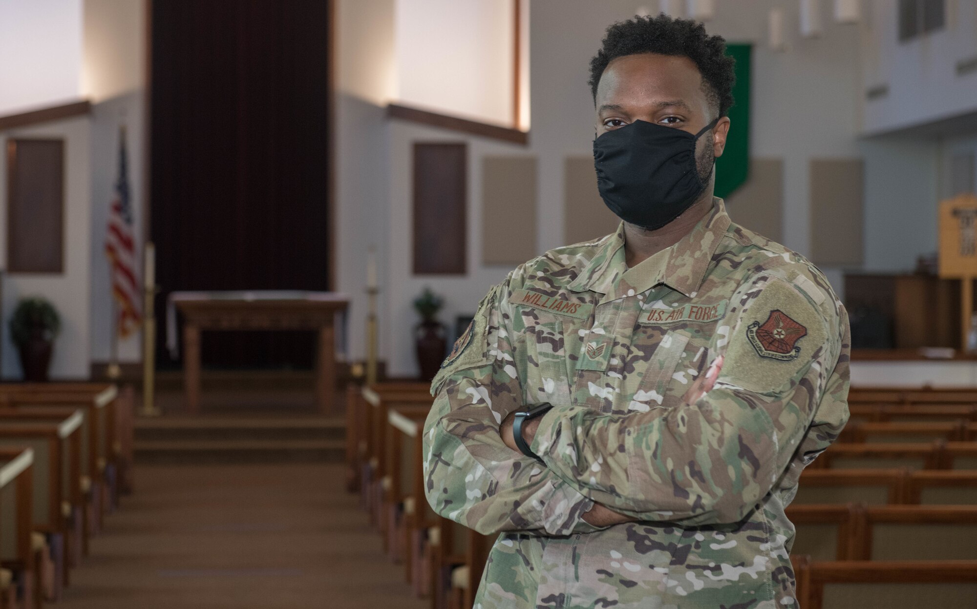 U.S. Air Force Tech. Sgt. Terrence Williams, a 509th Bomb Wing religious affairs Airman, poses in the Spirit Chapel sanctuary at Whiteman Air Force base, Missouri, July 7, 2020. Religious Affairs Airmen work with Chaplains to provide confidential counseling and support for religious needs and services. (U.S. Air Force Photo by Senior Airman Thomas Johns.)