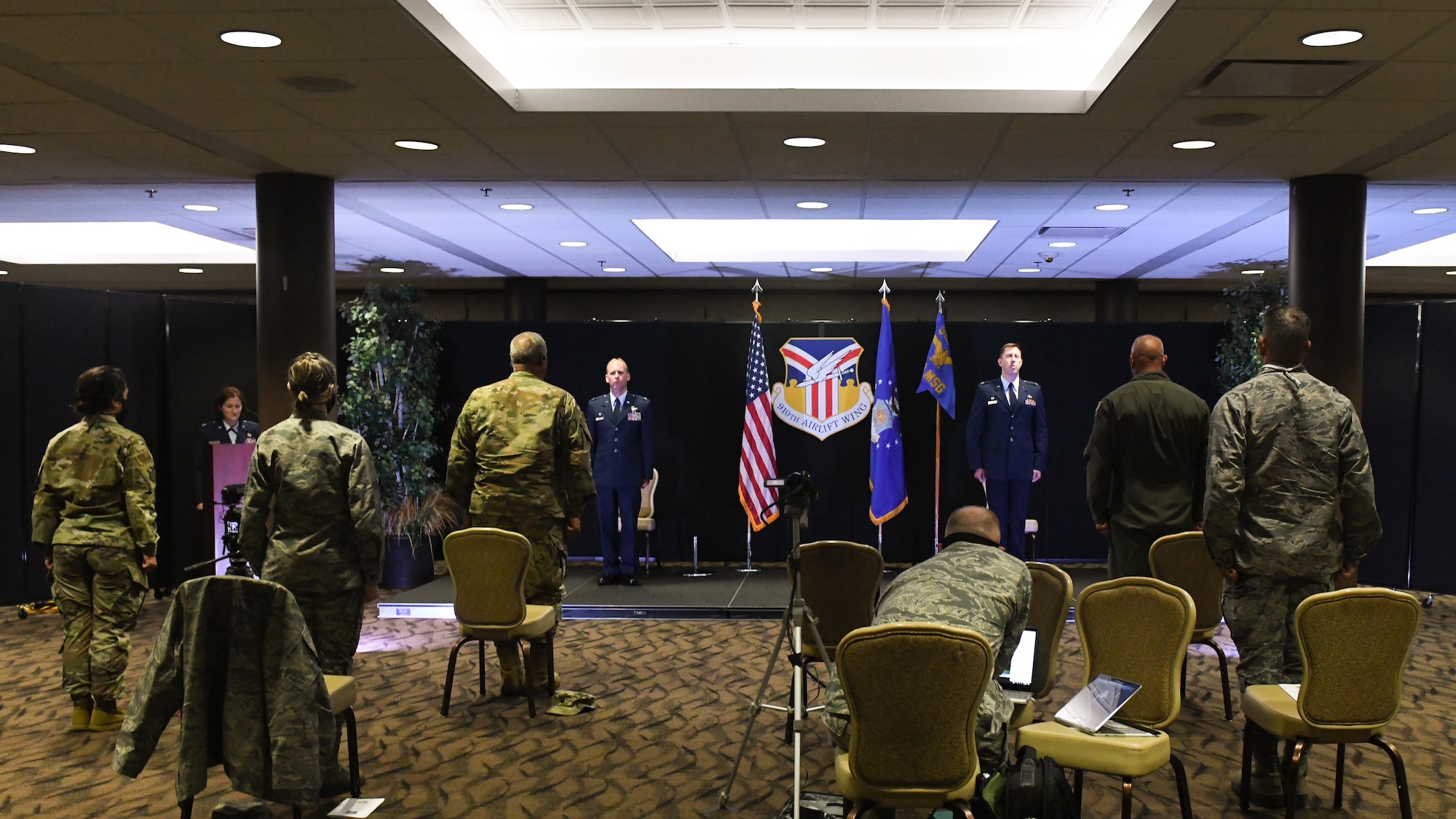 Members of the 910th Airlift Wing practice social distancing at an assumption of command ceremony, during the COVID-19 pandemic on July 11, 2020, Youngstown Air Reserve Station. Attendees and participants maintained six feet of distance in accordance with Air Force guidelines. Col. Gregory Meyer assumed command of the 910th Mission Support Group during the ceremony.