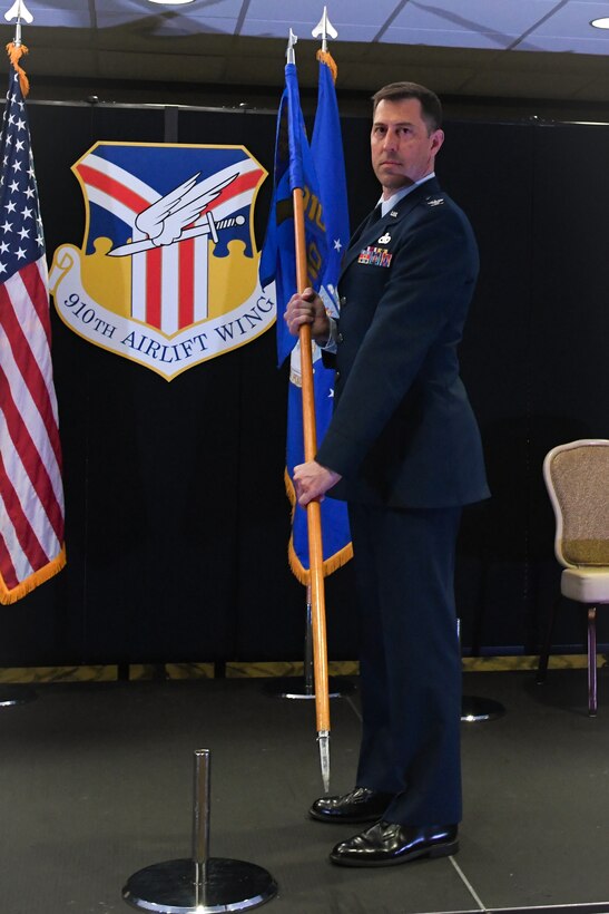 Col. Gregory Meyer, the new commander of the 910th Mission Support Group, receives the MXG guidon, from Col. Joe Janik, the 910th Airlift Wing commander, during a change of command ceremony at Youngstown Air Reserve Station, July 11, 2020. Meyer was previously a deputy group commander from Westover Air Force Base, Massachusetts.