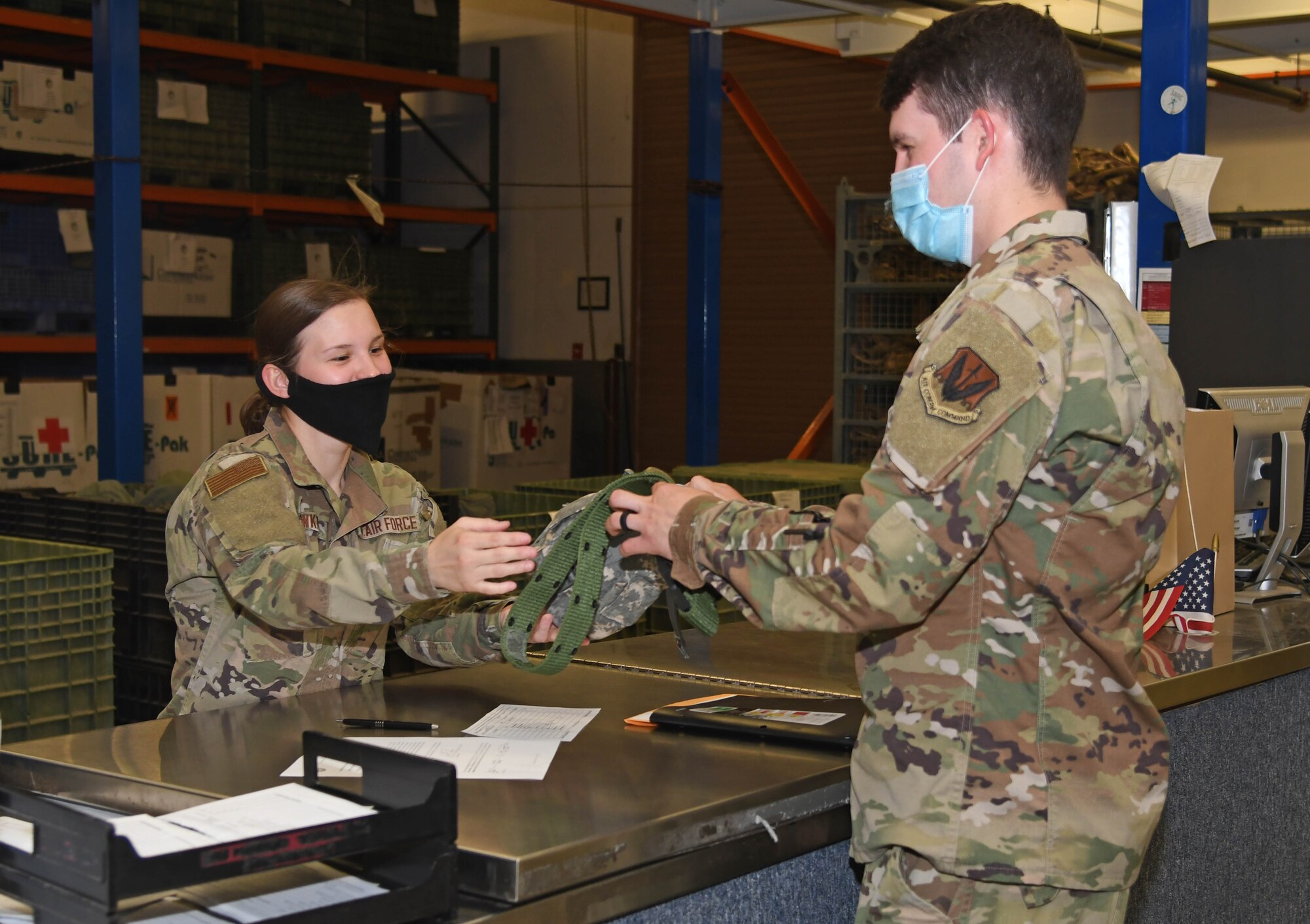 A photo of an Airman getting equipment.