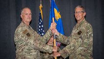 Col. Erich W. Schroeder, right, incoming 2nd Medical Group commander, receives the guidon from Col. Michael A. Miller, left, 2nd Bomb Wing commander, during a change of command ceremony at Barksdale Air Force Base, La., July 10, 2020. The passing of the guidon symbolizes a transfer of command.