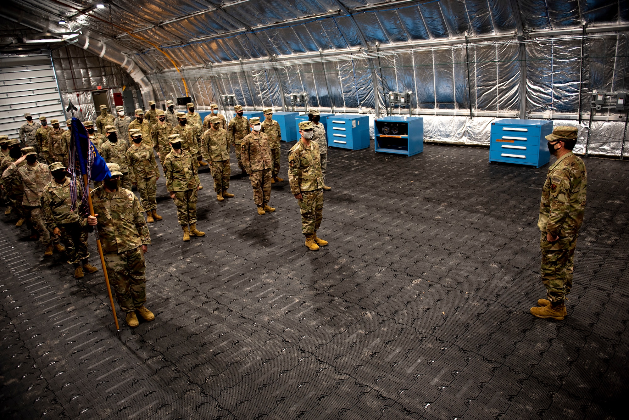 U.S. Airmen with the 81st Air Control Squadron stand at attention for U.S. Air Force Lt. Col. Steven Wyatt, 81st ACS commander, at Tyndall Air Force Base, Florida, July 8, 2020. Wyatt's change of ceremony was altered to comply with Coronavirus Disease 2019 (COVID-19) guidance. Wyatt's first salute was scheduled after the official ceremony. (U.S. Air Force photo by Staff Sgt. Magen M. Reeves)