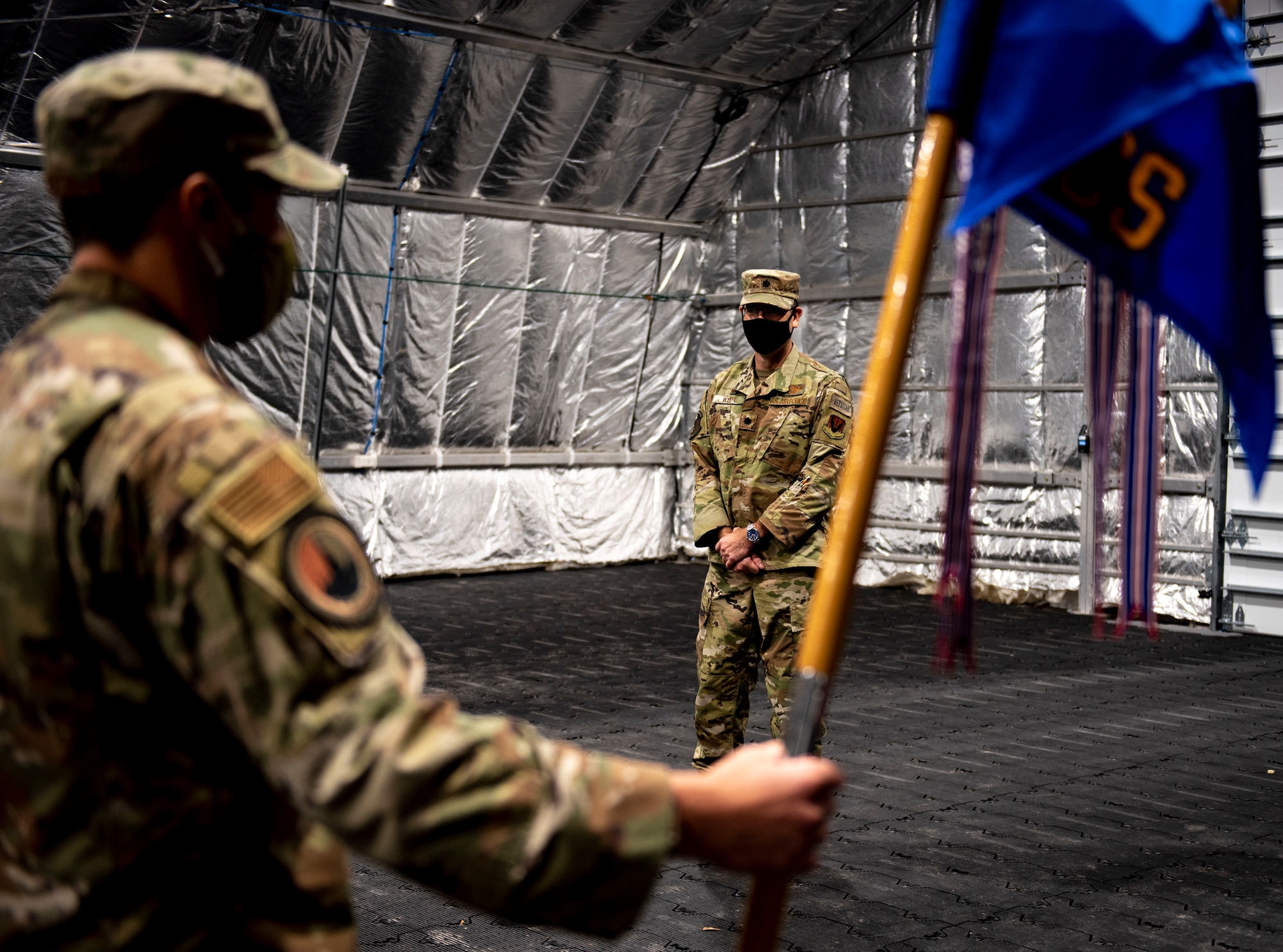 U.S. Air Force Master Sgt. John Reeves with the 81st Air Control Squadron stands at attention for U.S. Air Force Lt. Col. Steven Wyatt, 81st ACS commander, at Tyndall Air Force Base, Florida, July 8, 2020. Wyatt's change of ceremony was altered to fit Coronavirus Disease 2019 (COVID-19) guidance. Wyatt's first salute was scheduled after the official ceremony. (U.S. Air Force photo by Staff Sgt. Magen M. Reeves)