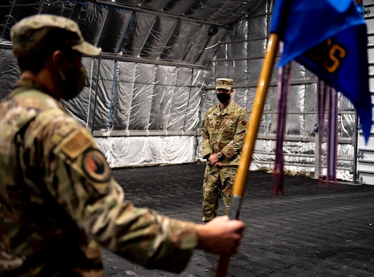 U.S. Air Force Master Sgt. John Reeves with the 81st Air Control Squadron stands at attention for U.S. Air Force Lt. Col. Steven Wyatt, 81st ACS commander, at Tyndall Air Force Base, Florida, July 8, 2020. Wyatt's change of ceremony was altered to fit Coronavirus Disease 2019 (COVID-19) guidance. Wyatt's first salute was scheduled after the official ceremony. (U.S. Air Force photo by Staff Sgt. Magen M. Reeves)