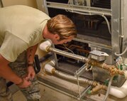Tech. Sgt. Joshua Barr, a heating, ventilation, air conditioning and refrigeration craftsman assigned to the 628th Civil Engineer Squadron, troubleshoots a water source heat pump to fix the cooling system for the 560th RED HORSE Squadron’s operations building at Joint Base Charleston, S.C., July 9, 2020. Members of 628th CES/HVAC service around 270 buildings throughout the base to keep the infrastructure maintained and developed.