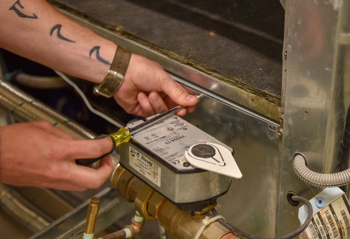 Tech. Sgt Joshua Barr, a heating, ventilation, air conditioning and refrigeration craftsman assigned to the 628th Civil Engineer Squadron, troubleshoots a water source heat pump to fix the cooling system for the 560th RED HORSE Squadron’s operations building at Joint Base Charleston, S.C., July 9, 2020. Members of the 628th CES/HVAC service around 270 buildings throughout the base to keep the infrastructure maintained and developed.