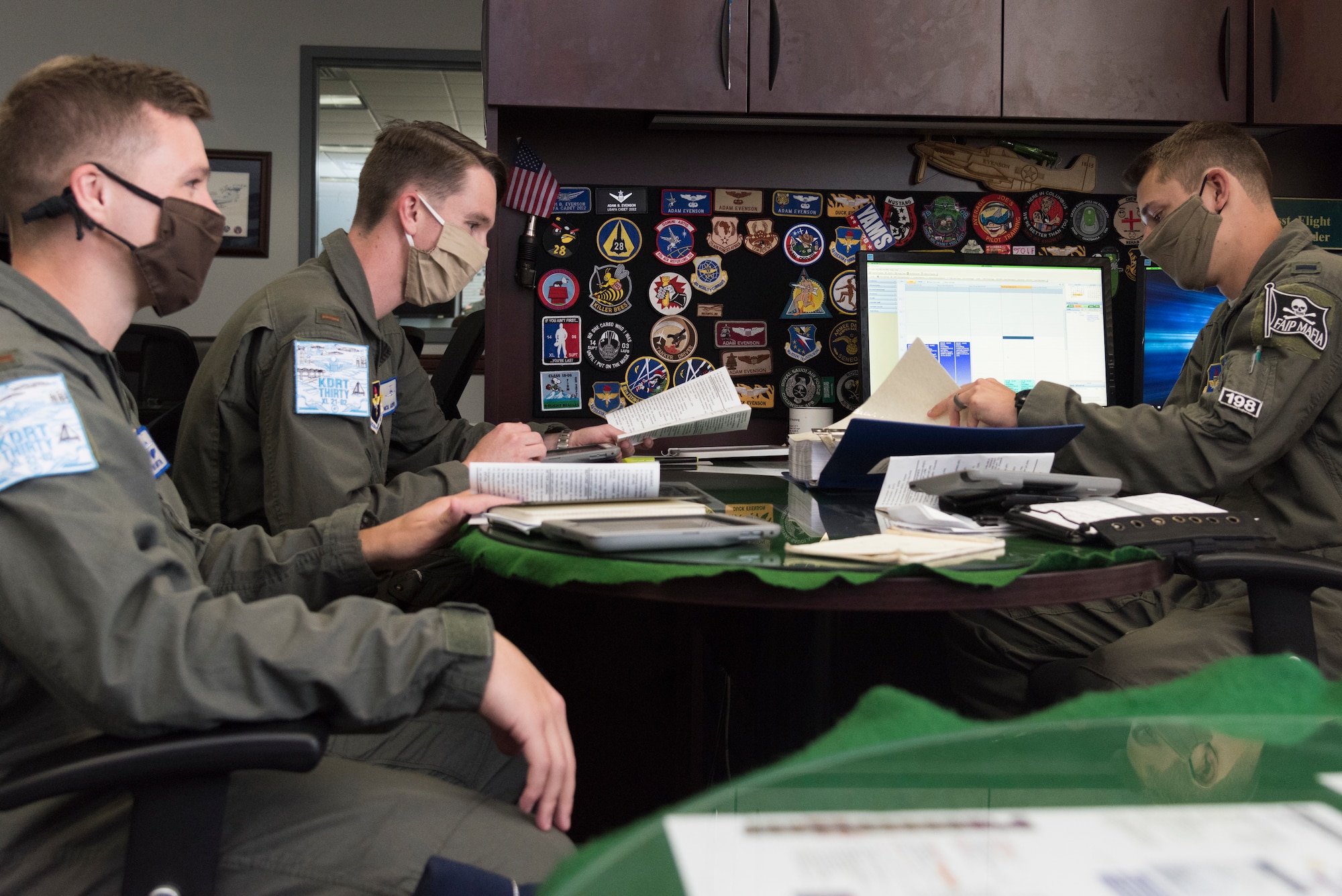 First Lt. Zachary Froembling, 86th Flying Training Squadron instructor pilot, briefs 47th Student Squadron students, 2nd lieutenants Nicholas Jasper and Maurice Martin, for a simulator mission, June 25, 2020 at Laughlin Air Force Base, Texas. The simulators are a crucial part of Specialized Undergraduate Pilot Training students’ curriculum, because they provide a safe place to learn from mistakes. (U.S. Air Force photo by Senior Airman Anne McCready)